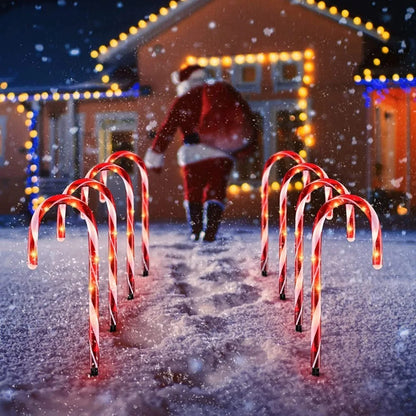 5pcs LED candy cane Christmas lights — battery-powered decorations for garden paths or indoor holiday rooms.