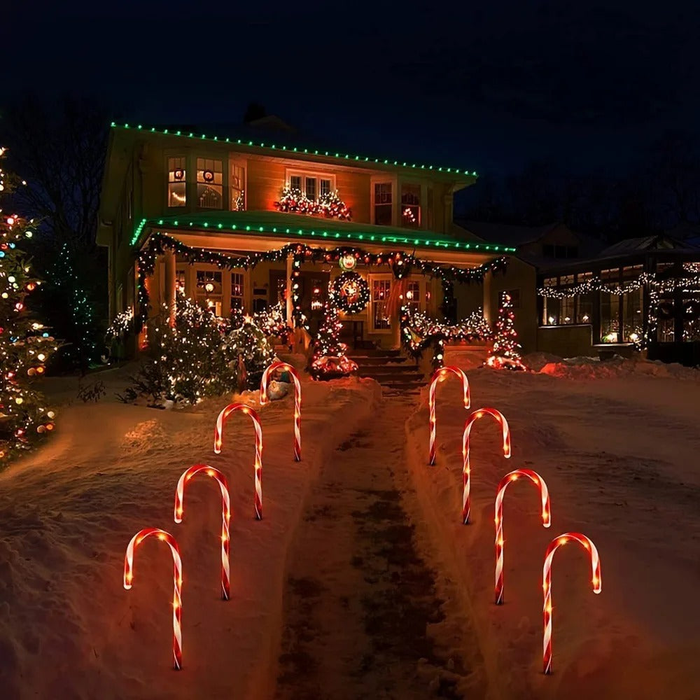 5pcs LED candy cane Christmas lights — battery-powered decorations for garden paths or indoor holiday rooms.